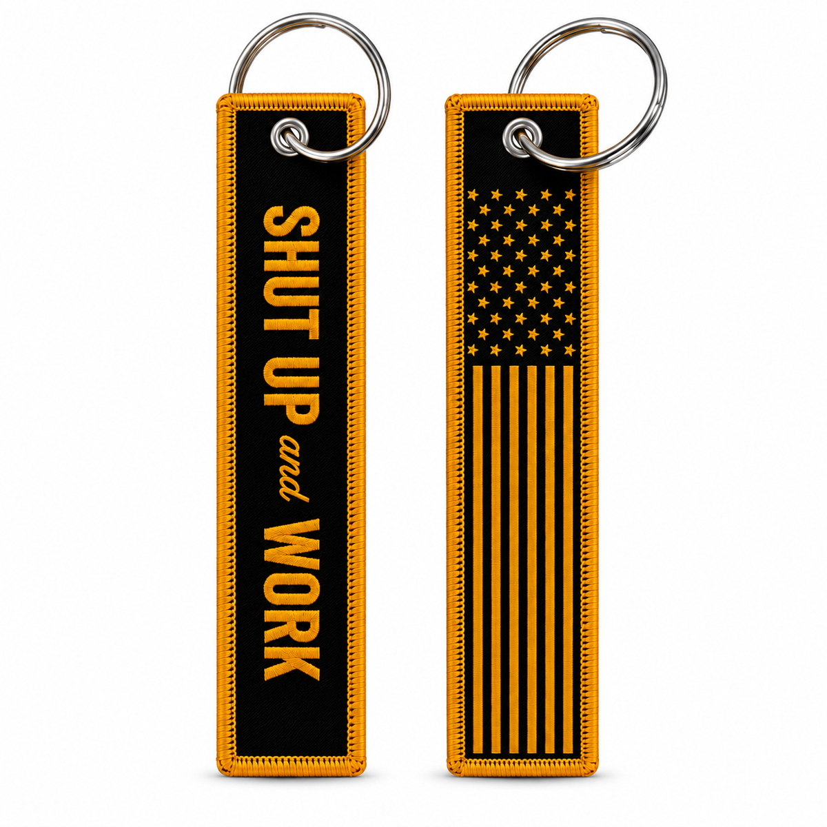 Two black and yellow keychain pouches shown side by side on a white background. The left pouch has the text 'SHUT UP and WORK' in yellow on a black background, and the right pouch features a yellow American flag design on a black background with a silver key ring.