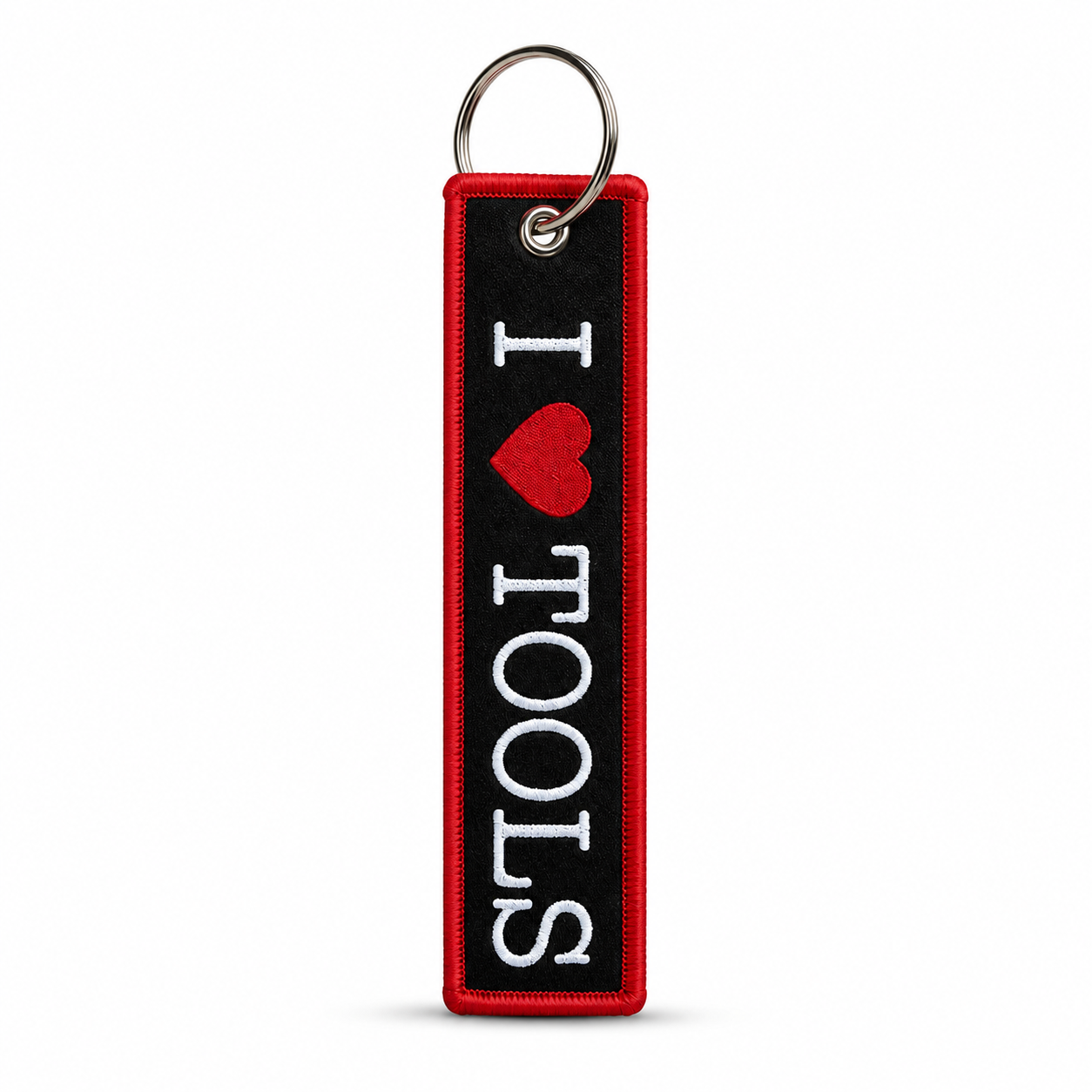 Black woven keychain tag with red border and white "I heart TOOLS" lettering with a red heart, attached to a metal split ring.