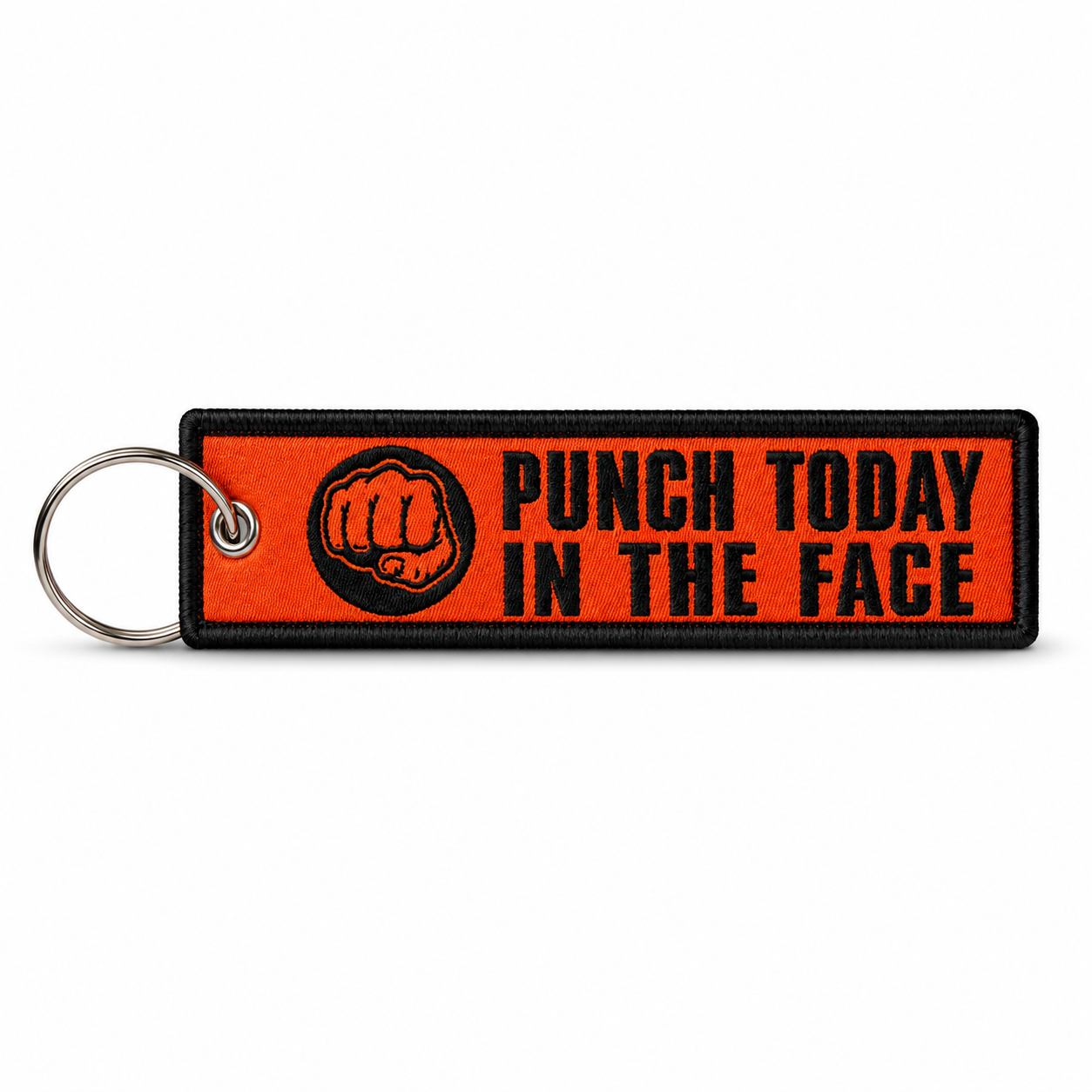 Orange woven keychain tag with black border, a black fist icon, and "Punch Today In The Face" in black lettering, attached to a metal split ring.
