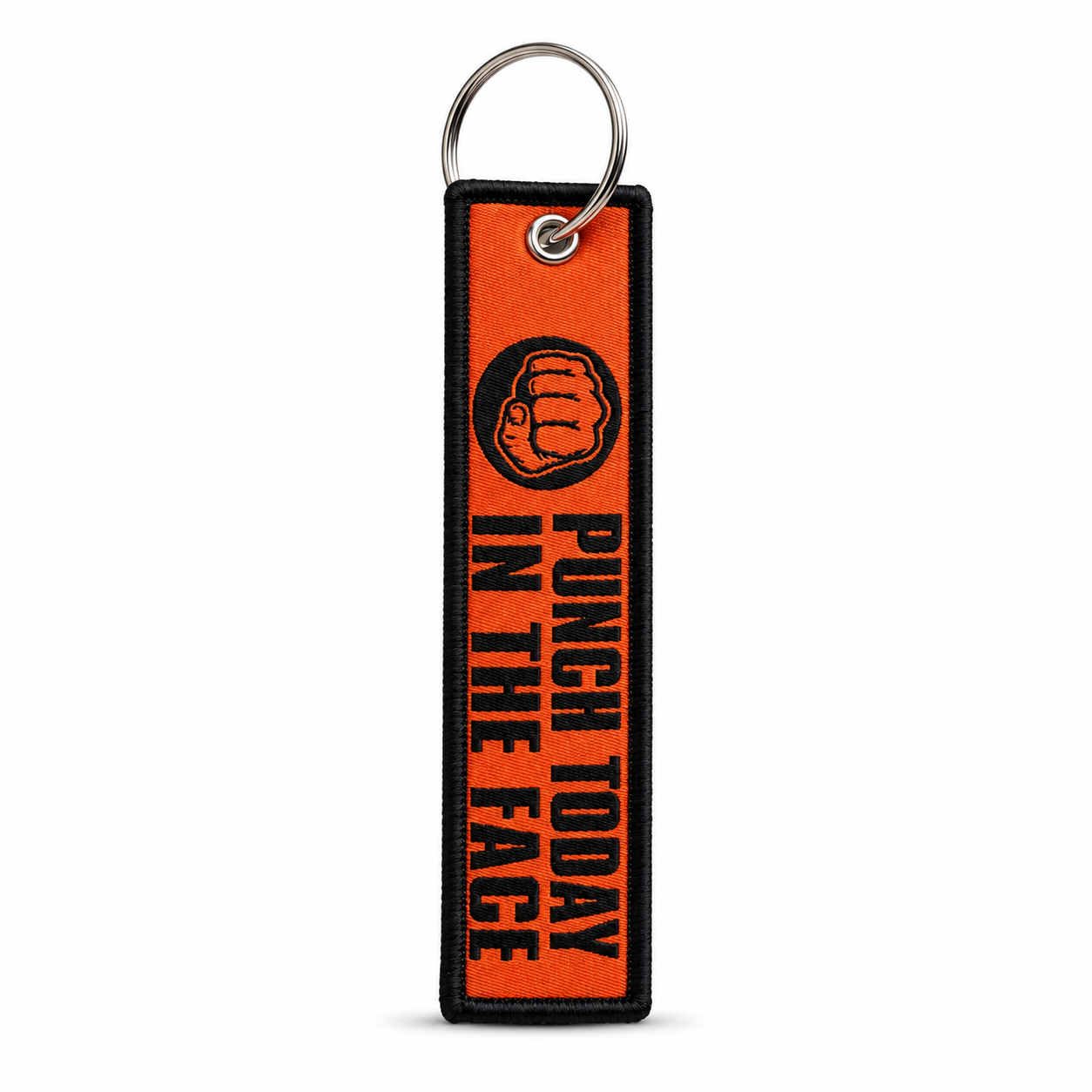 Orange woven keychain tag with black border, a black fist icon, and "Punch Today In The Face" in black lettering, attached to a metal split ring.