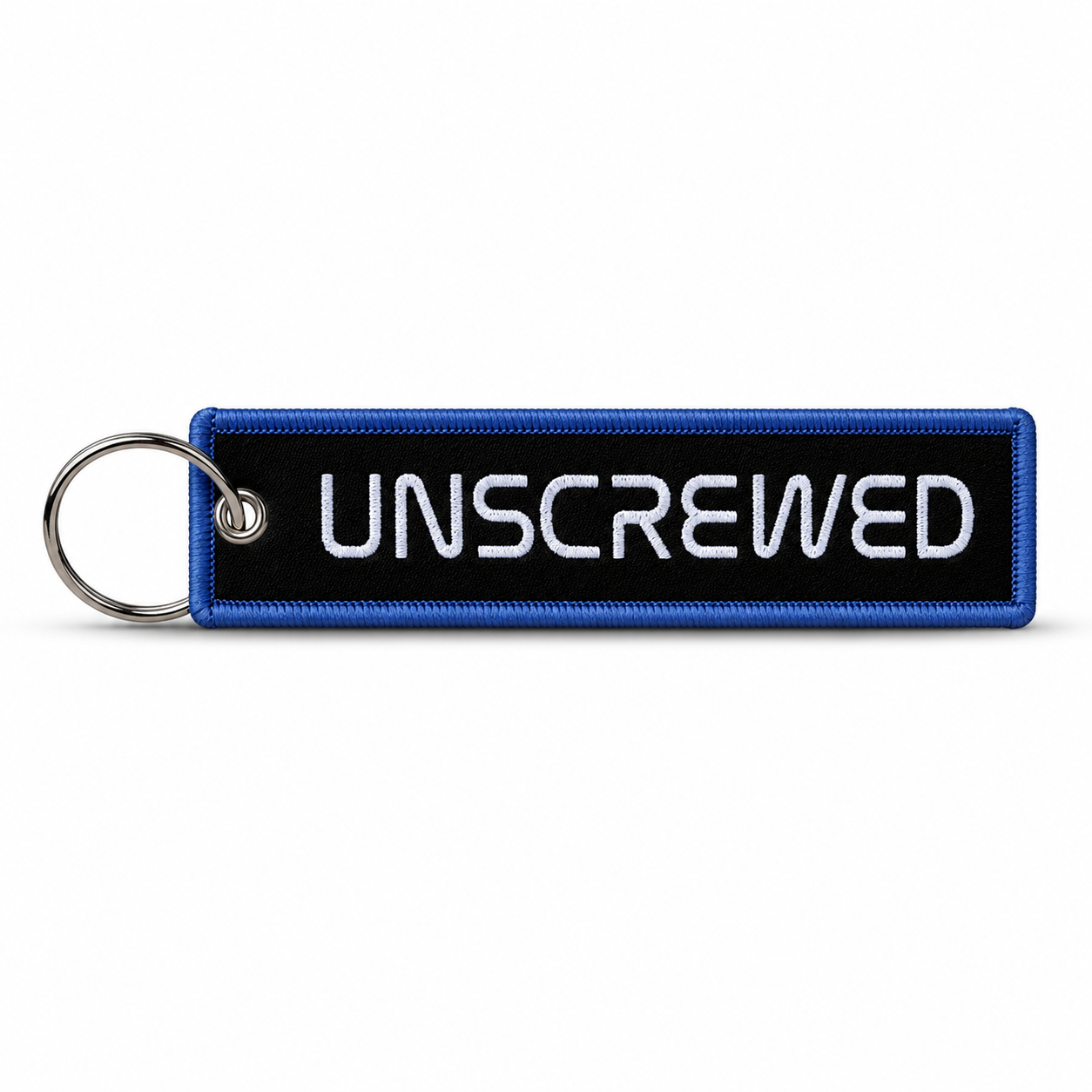 Black embroidered keychain tag with blue border and white "Unscrewed" lettering, attached to a metal split ring.