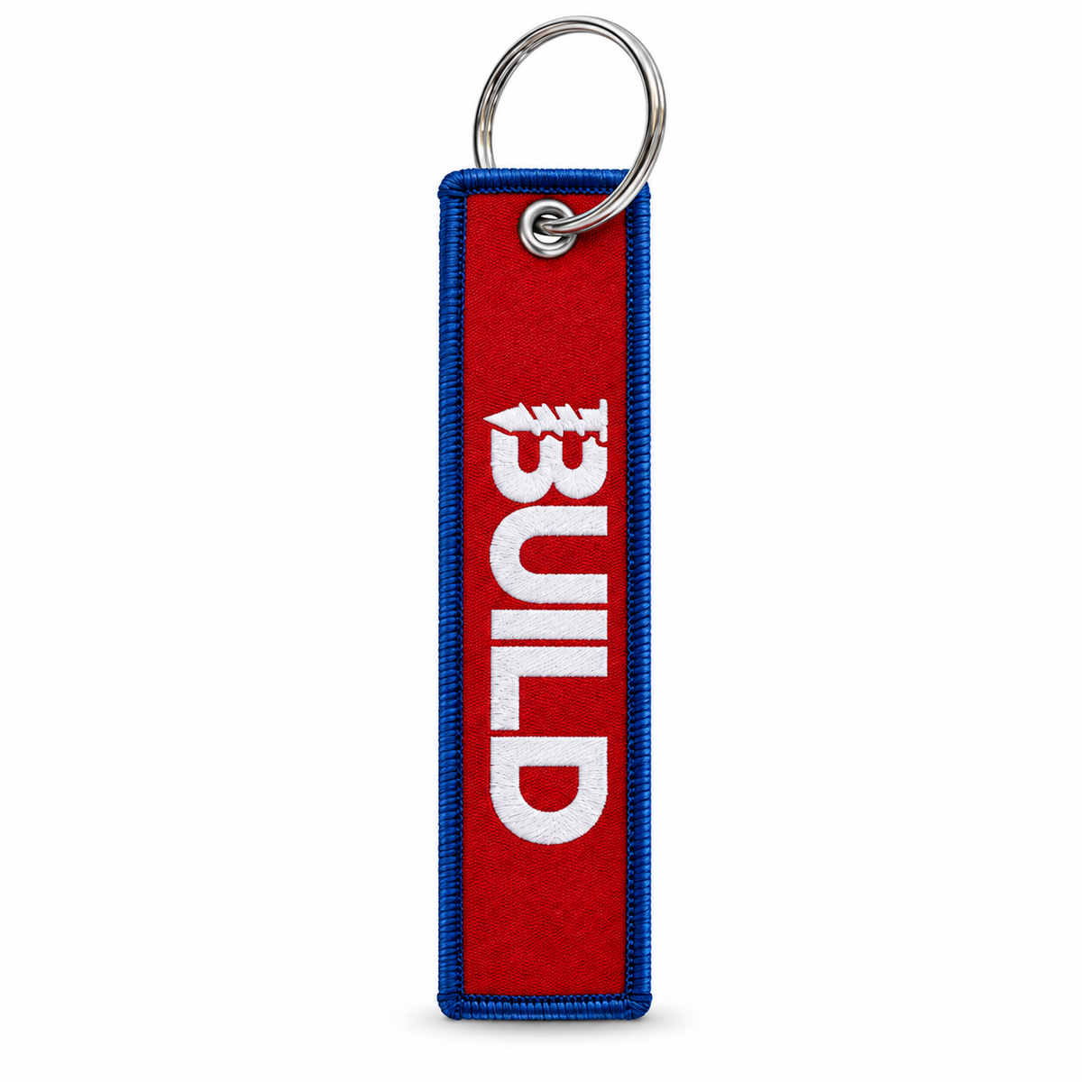 A red and blue fabric keychain tag with the word 'BUILD' in white, attached to a silver metal split ring, shown on a plain white background.