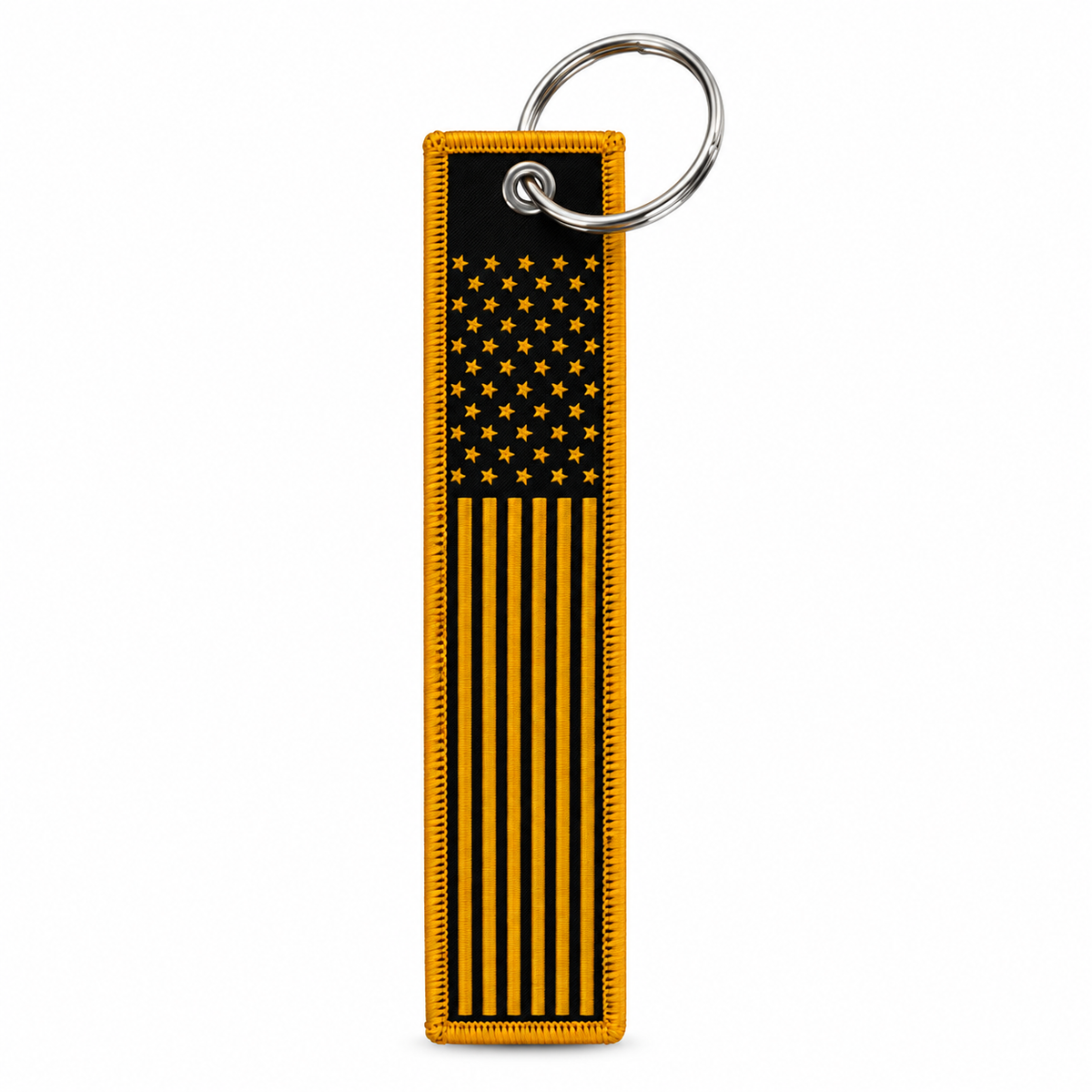 A vertical rectangular keychain featuring a stylized black and yellow American flag design with a silver metal key ring, shown on a plain white background.