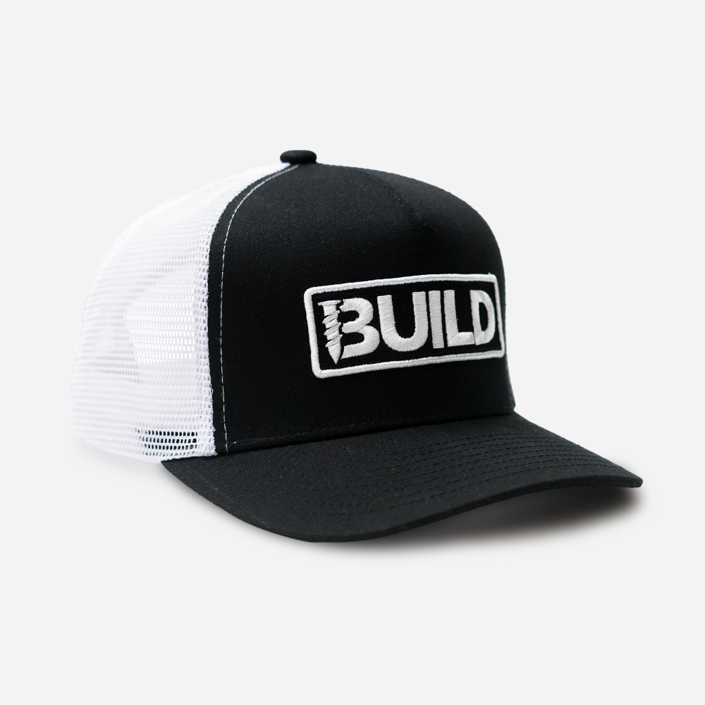 Black and white cap with 'BUILD' logo on a white background