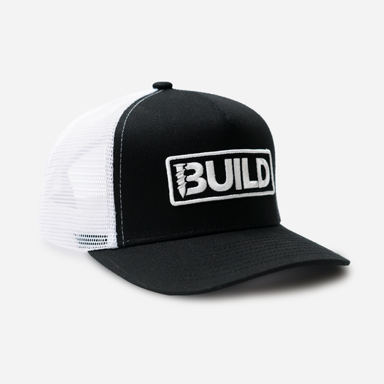 Black and white cap with 'BUILD' logo on a white background
